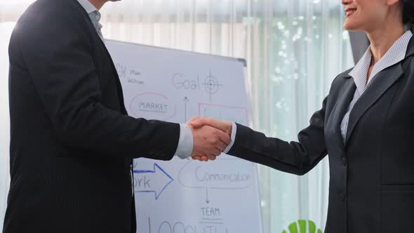 Asian businessman and woman handshake after negotiations for Business deal.