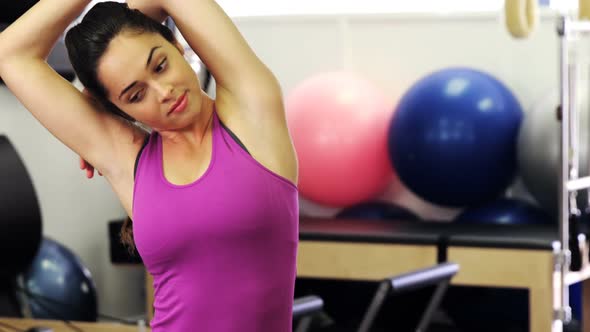 Beautiful woman exercising in fitness studio