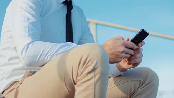 Using Mobile Phone On Nature. Holding Smartphone Using Outdoors. Freelancer Man Mobile Working.