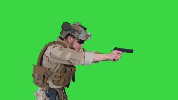 Modern Soldier, Counter Terrorist Squad Fighter Aiming and Shooting with Pistol on a Green Screen