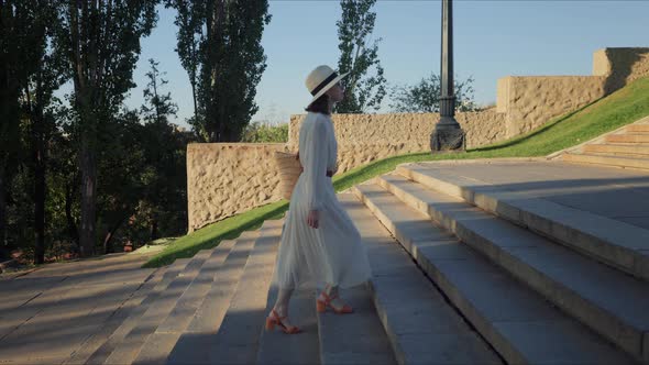 A young girl climbing the steps