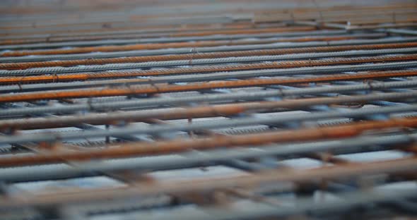 Footage of the Rusty Metal Rods in Rows at a Construction Site Armature