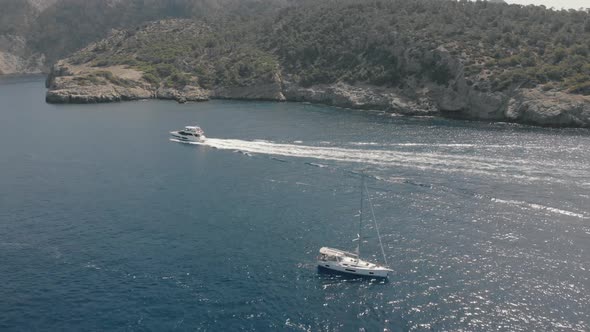 Aerial View of Yachts Near Rocky Island of Mallorca