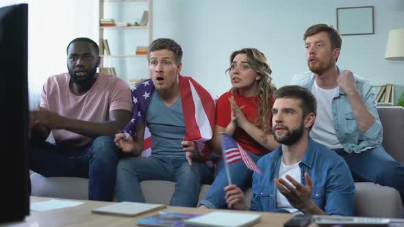 Multiracial American Fans Watching Match on TV at Home, Celebrating Team Goal