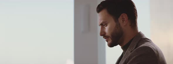 Handsome bearded man looking ahead