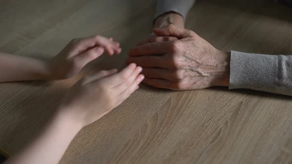 Little Girl Touching Grandmother Hands, Relatives Support, Family Generations