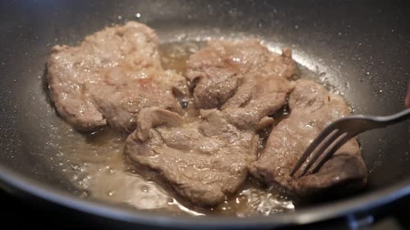 Tasty looking pork steaks in wok slow-mo 1920X1080 HD footage - Close-up of preparing meat in hot oi