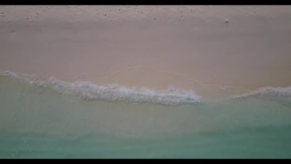 Aerial above abstract of paradise seashore beach adventure by blue ocean with white sandy background