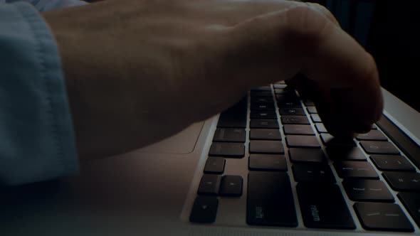 Alternative Macro Close Up of an Young Business Man Hands Busy Working on Laptop or Computer