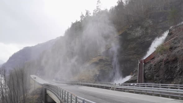 Water falling and flying in Svandalsfossen waterfall in Norway, view from the road_slomo