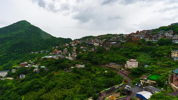 time lapse of Jiufen village with mountain in raining day, Taiwan