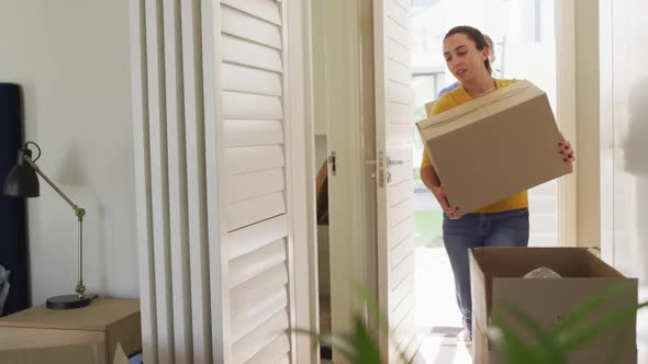 Happy caucasian couple in love moves into an apartment