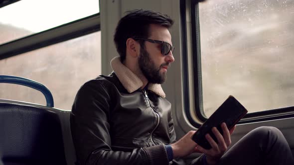 Peaceful Businessman Take Break Relax After Hard Work In Office Enjoy Reading Book On Tram. Diary.