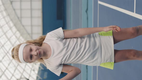 Little Girl With Tennis Racket On Court