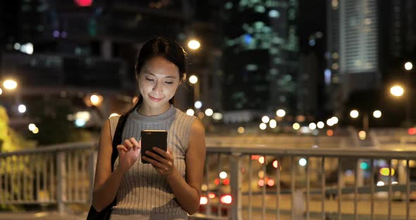 Business Woman Use of Mobile Phone in City 