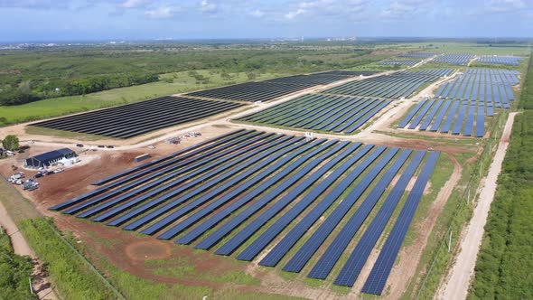 Large solar farm in lush countryside of El Soco, Caribbean; aerial