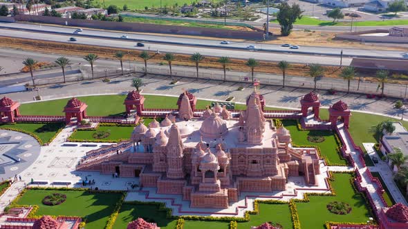Aerial fast panning left view of a Hindu temple near Los Angeles California