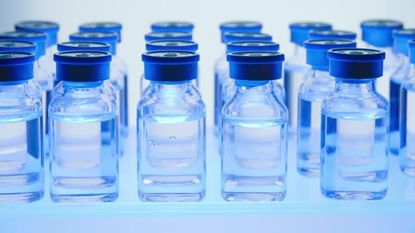 Group of Vaccine bottles. Medicine in ampoules. Glass vials for liquid samples in laboratory.