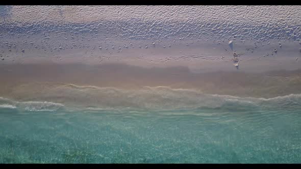 Aerial flying over nature of perfect coastline beach voyage by transparent water with bright sand ba