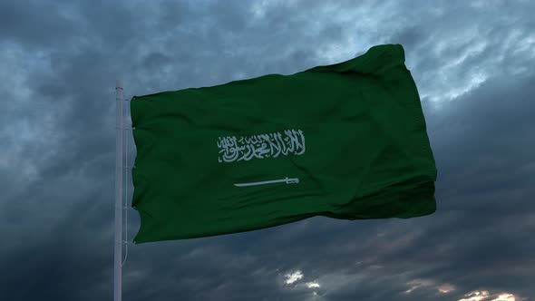 Realistic Flag of Saudi Arabia Waving in the Wind Against Deep Heavy Stormy Sky