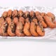 place the grilled river prawns in a row on foil for sell and delivery. - VideoHive Item for Sale