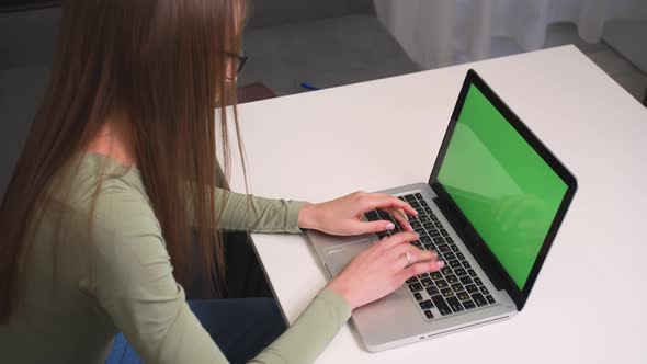 Woman in Glasses Working on Laptop Green Screen Chromakey