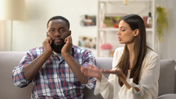 Annoyed Black Man Ignoring Conversation With His Girlfriend, Misunderstanding