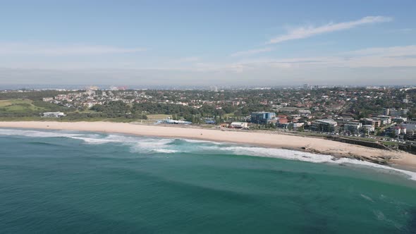 Aerial establishing shot of Maroubra Beach in Sydney, New South Wales, Australia. Reverse backward f