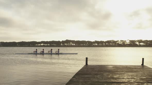 Female rowing team training on a river