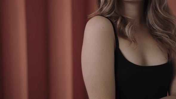 Close Shot of Woman's Hands Touching Her Body in Pink Studio Natural Beauty