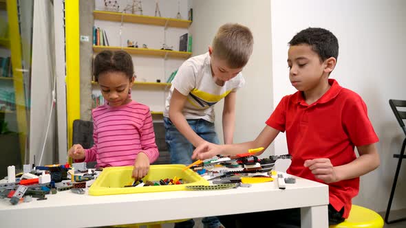 Children Using Building Kit to Create Robots