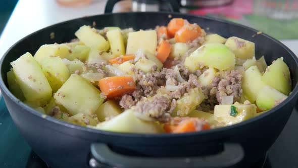 Preparation of Stew with Potatoes Minced Meat Zucchini Carrots