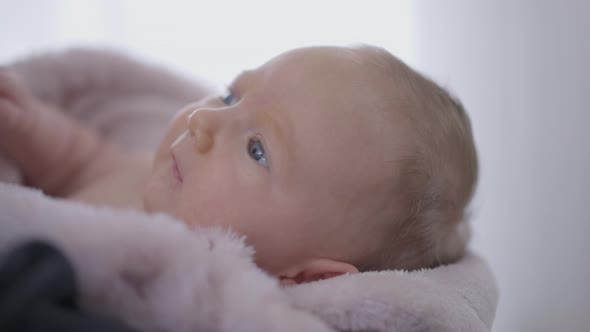 Closeup Cute Newborn Baby Girl Looking Away Moving Hands