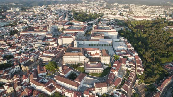 Aerial pullback universities Square, revealing Riverside Coimbra Downtown, Portugal