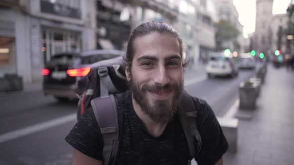 Close Up of a Happy Young Male Smiling for the Camera in Slow Motion