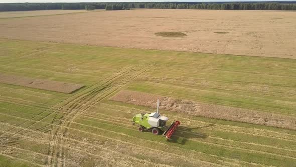 Aerial View Modern Combine Drives To Orange Truck on Field