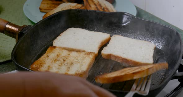 Brioche Toast Bread is Slowly Fried in a Hot Frying Pan