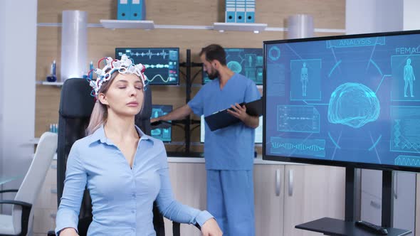 Female Patient Falling Asleep While Wearing Brain Activity Scanner