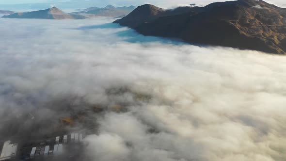 Aerial view of Unalaska Bay with fog on Unalaska island, Alaska, United States.