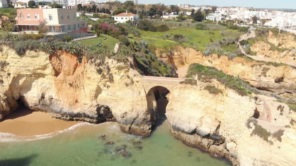 Roman style bridge connecting rock outcrops of Lagos Shoreline, Algarve, Portugal