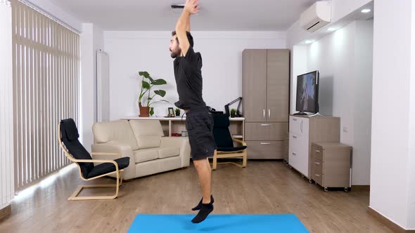 Athletic Man Exercising at Home