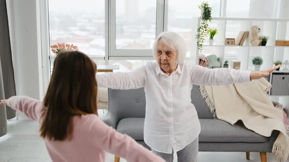 Grandmother and Granddaughter Exercising