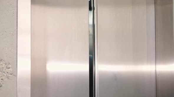 Businessman Exit on Elevator Alone at Company