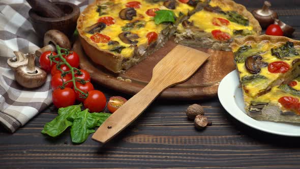 Traditional French Baked Homemade Quiche Pie on Wooden Board