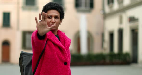 Portrait of woman making stop gesture, Pistoia, Tuscany, Italy