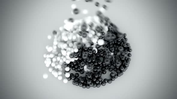 Falling black and white pebbles forming the perfect Yin-yang symbol. HD