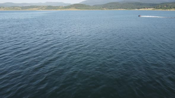 Aerial View of a Scooter at the Lake Surface