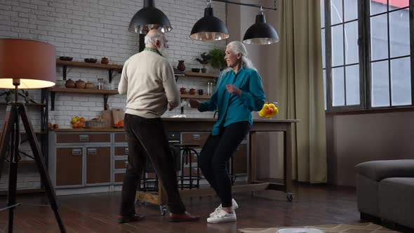 Young at Heart Old Couple Enjoying Dancing at Home