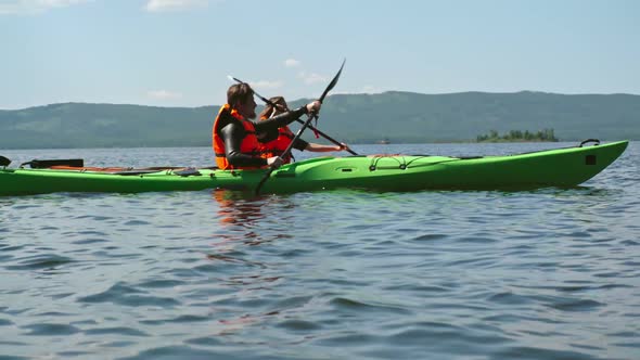 Lake Kayakers Paddling Together