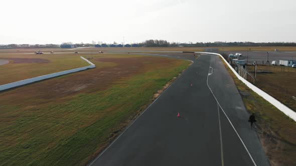 Four Cars Compete on the Race Track